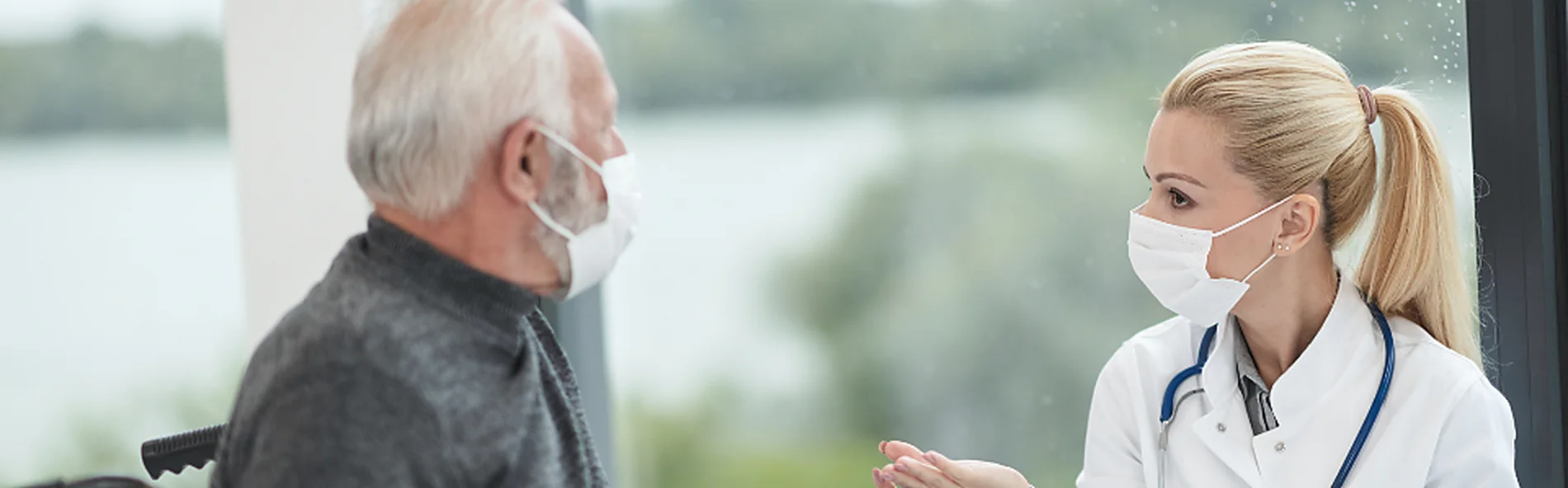 A clinician assessing a patient during a consultation